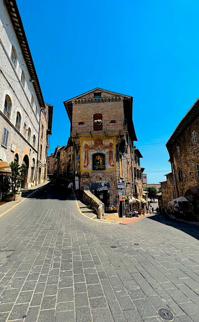 Decorated building in Assisi, Italy. Unsplash@Itsatheerkh