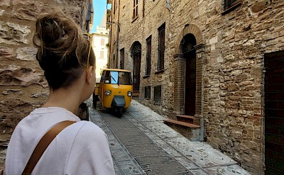Waiting for a tuk tuk to pass in Spello, Italy. Unsplash@Luca Fantini