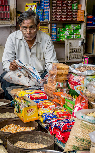 Shopkeeper in New Delhi, India. Flickr:Steven dosRemedios