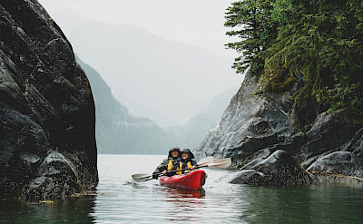 Kayaking guests on Alaska small boat cruise. ©TO