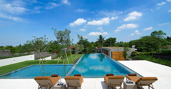 The Iman Villa Sunloungers By The Pool